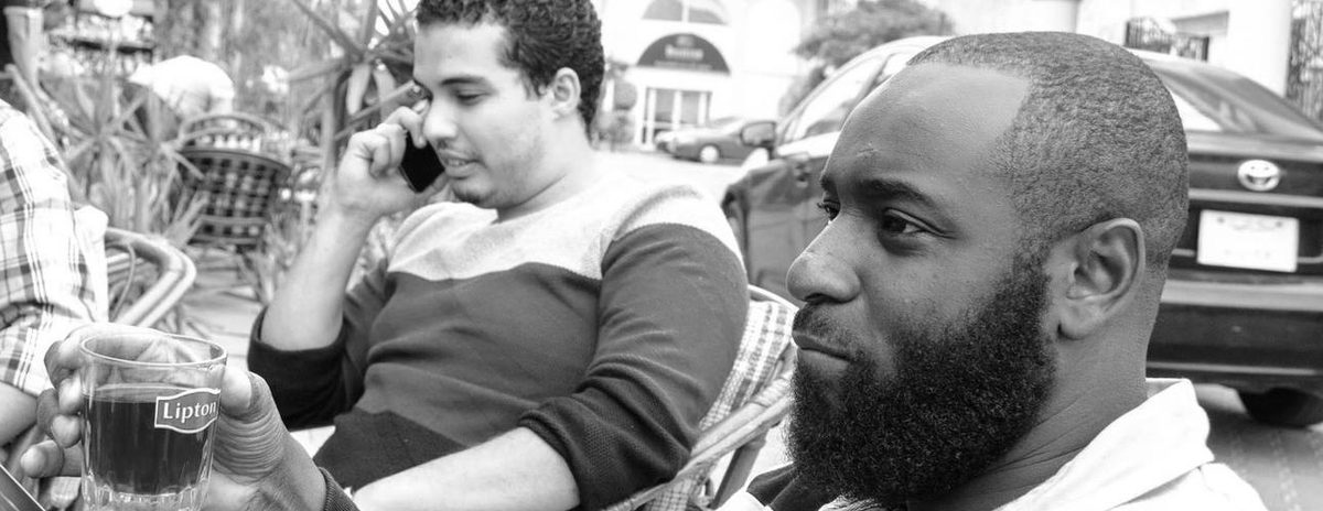 Abdul Osama and Henry Kofi Amankwah having tea at a street café in Alexandria, Egypt